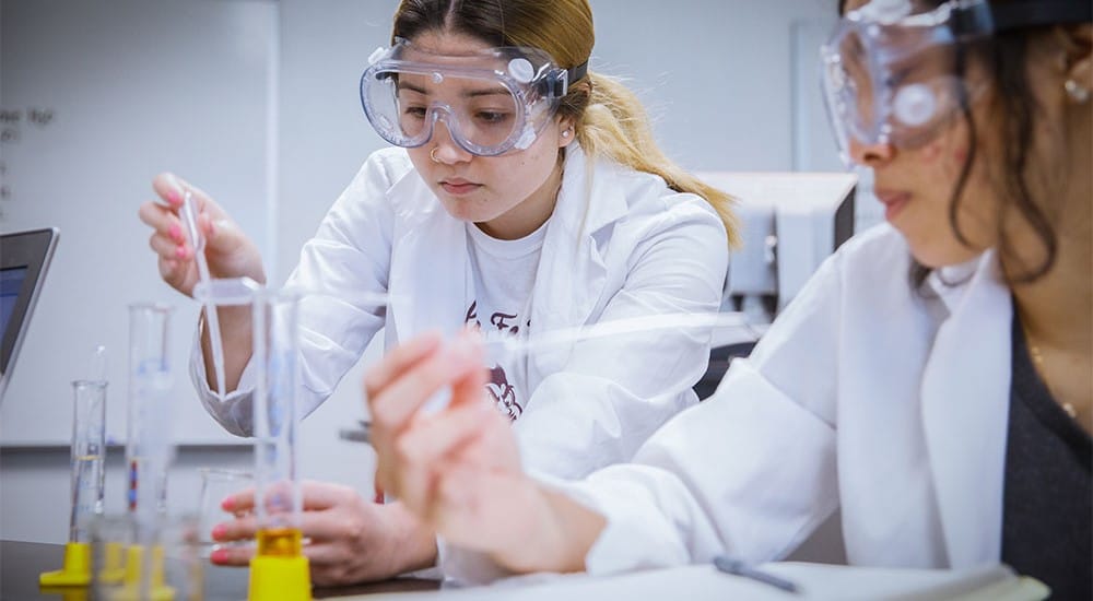 Students working with pipettes