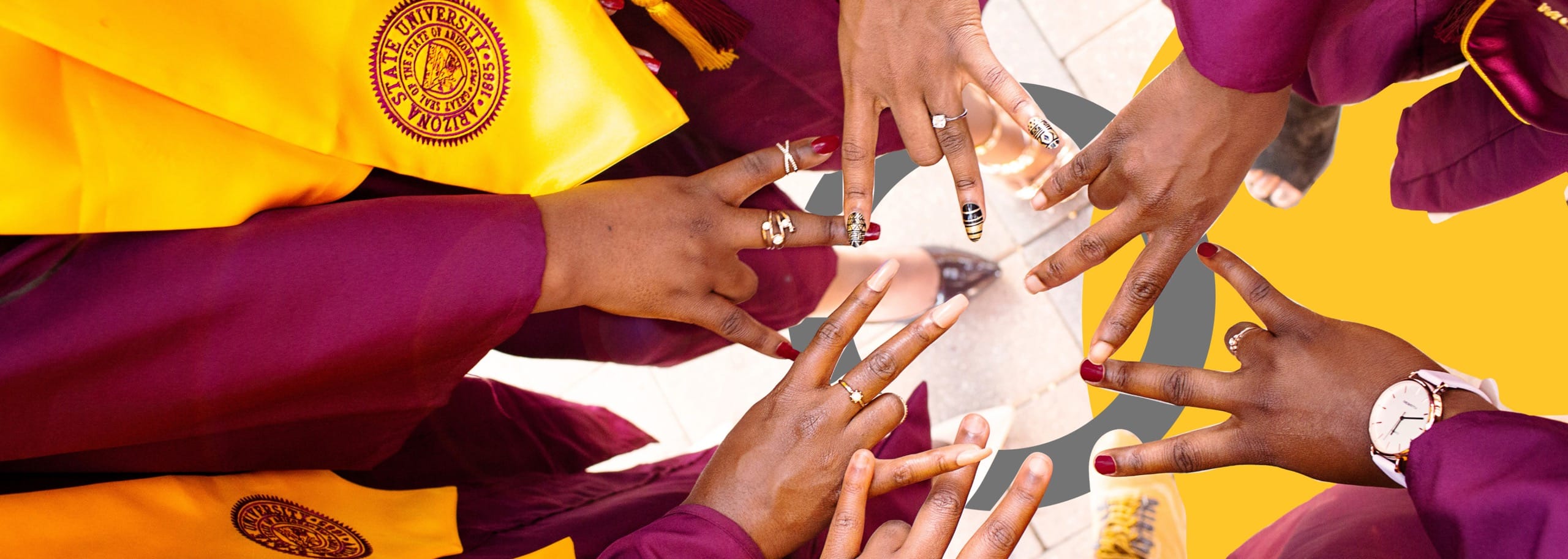 ASU students with the forks up sign