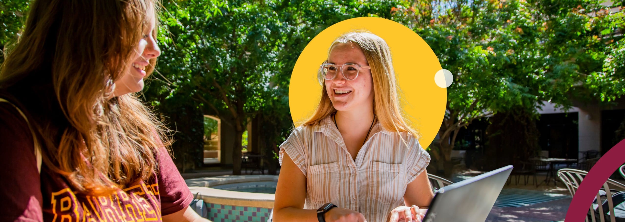 Two ASU women sitting outside and smiling