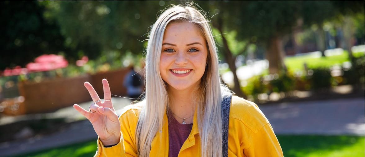 Woman showing ASU school spirit