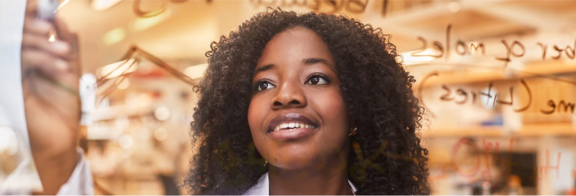 Black woman writing on a screen